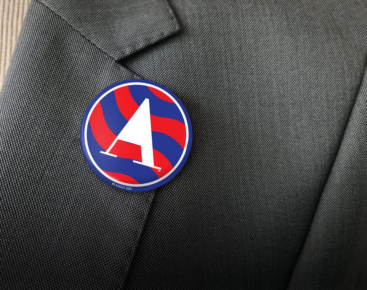 Election candidate wearing a No A-Holes button on lapel.